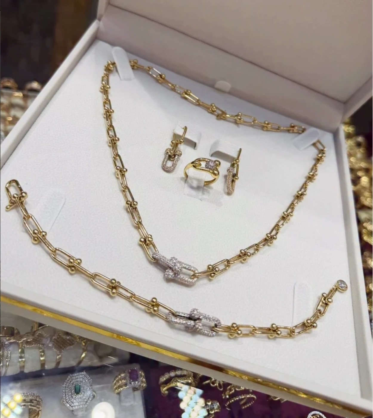 Shop photo of the gold chain set in its box